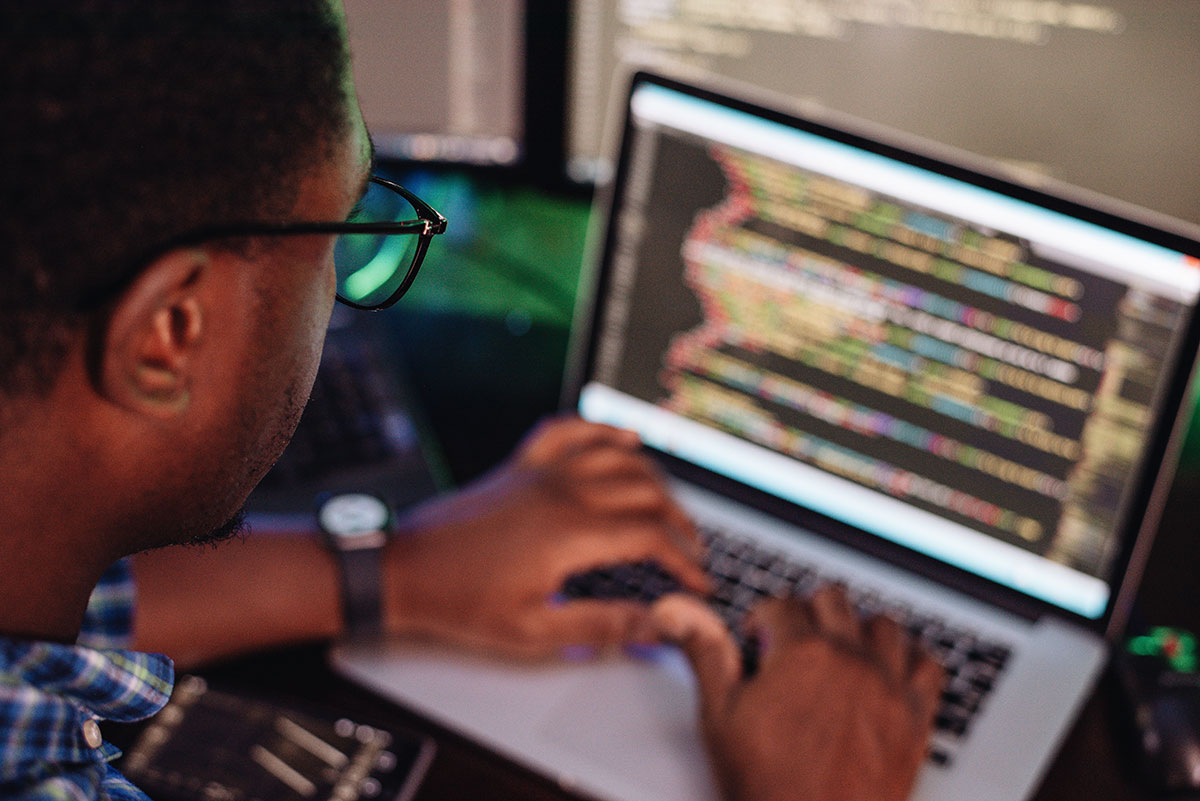 black-male-in-front-of-computer-screen-coding-mobi-2021-08-29-08-49-00-utc